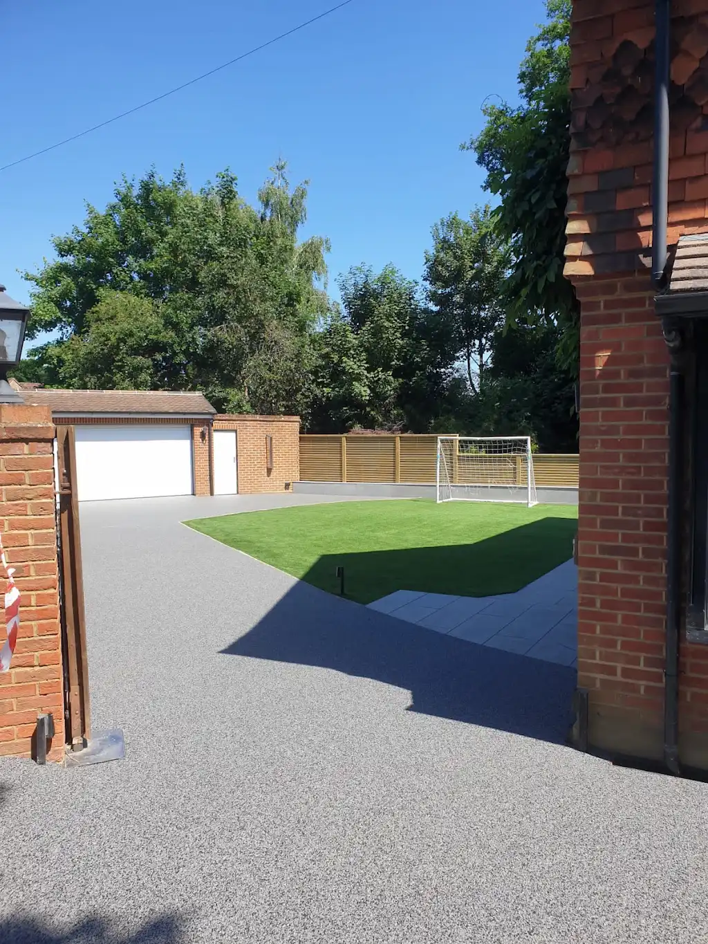 Block-paved driveway with circular feature in Surrey
