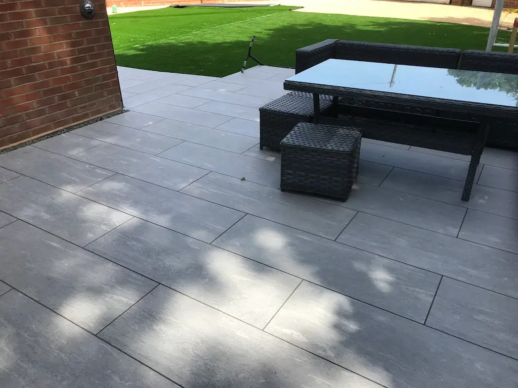 Contemporary porcelain patio with garden furniture